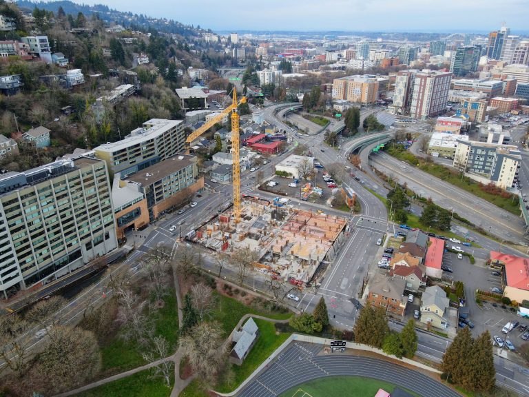 Aerial drone photo of Portland, Oregon building construction site and crane